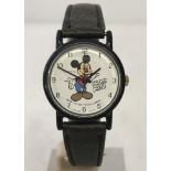 1987 Mickey Mouse wristwatch with brown leather strap.