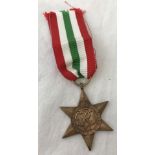 A WWII pattern The Italy Star medal on red, white and green ribbon.