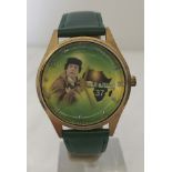 Very unusual Gadaffi ex Libyan leader propaganda watch on green leather strap.