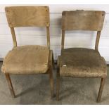 A pair of vintage light wood school chairs.