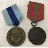 2 Indonesian military medals.