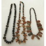3 natural stone necklaces to include carnelian and agate in shades of brown.