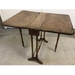 A miniature walnut Victorian Sutherland table with ceramic castors.