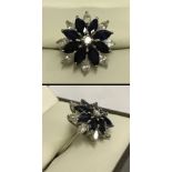 An 18ct white gold sapphire & diamond cluster ring.