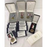 A quantity of 14 assorted boxed medals.