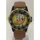 A Disney Donald Duck yellow and black wristwatch in working order.