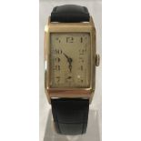 A vintage 14ct gold oblong cased gents wristwatch with square subsidiary seconds dial.