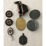 7 assorted WWII pattern German badges and medals.