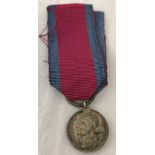 A modern miniature replica of the Waterloo Campaign medal.