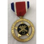A Columbian Artillery Battalion Distinguished Service medal.