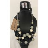 A Jaeger statement necklace of black, white and grey colouration with original tag.
