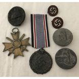 7 assorted WWII pattern German badges and medals.