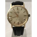 A 1962 Omega Geneve 14ct gold cased gents automatic wristwatch.