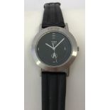 A stainless steel cased Timex "Star Trek" wristwatch with black leather strap.