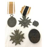 5 assorted German WWII pattern medals and badges.