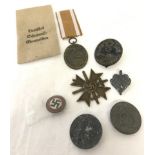 7 assorted German WWII pattern medals and badges.