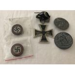 4 assorted WWII pattern German badges together with a German WWI pattern Iron cross medal.
