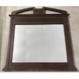 An Art Nouveau Oak wooden framed over mantle mirror.