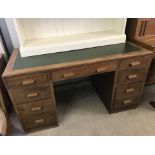 A vintage leather topped oak double pedestal desk.