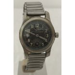 A 1940's Aviators Wyler waterproof black dial 15 jewels watch.