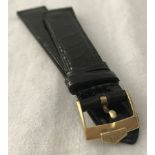 A leather crocodile patterned watch strap with 18ct gold Tag Heuer buckle.