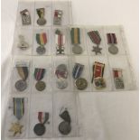 3 sheets containing 18 assorted medals.