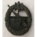 A WWII pattern Kriegsmarine Costal Artillery badge.