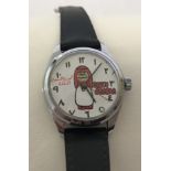 A vintage 1960's Peanuts wind up wristwatch depicting Charlie Brown in Saudi Arabia.