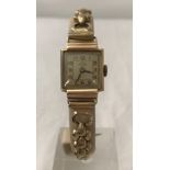 A ladies vintage Mardon 9ct gold case cocktail wristwatch with Champion flex gold plated strap.