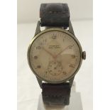 A 1940's Mingnon French antimagnetic gents watch with original strap, dial and hands.
