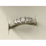 An 18ct white gold 5 stone princess cut diamond eternity ring.