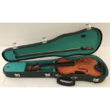 A cased violin complete with bow.