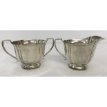 A matching hallmarked silver 2 handled sugar bowl with matching milk jug.