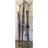 A collection of cross country skis and ski poles.