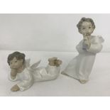2 Lladro ceramic angel figurines. #4540 Angel with flute and #4541 Angel laying down.