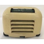 A 1950 cream bakelite Kolster Brandes "Toaster" radio, originally marketed as "The Magic Midget".