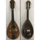 A vintage cased Stridente Italien 8 stringed Mandolin.