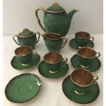 A Carlton Ware green & gilt part coffee set.