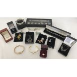 A collection of boxed and unboxed costume jewellery.