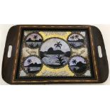 A vintage wooden framed tray from Brazil set with butterfly wings.