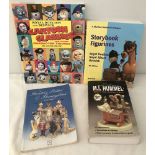 A small collection of reference books on figurines.