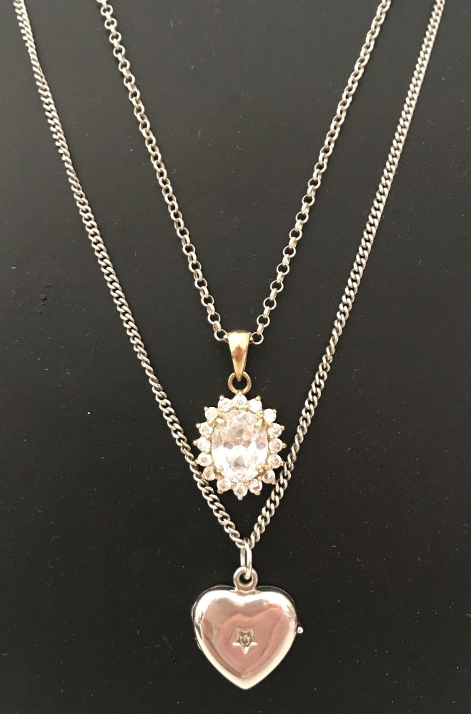 A classic design crystal set pendant on a 925 silver chain.