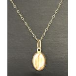A 9ct gold coffee bean pendant and chain.