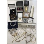 A collection of boxed and unboxed costume jewellery.