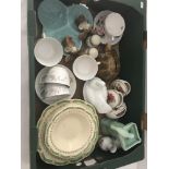 A box of assorted ceramics.