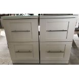 A pair of white painted short filing cabinets/bedside cabinets. With glass tops.