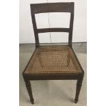 A cane seated hall chair.