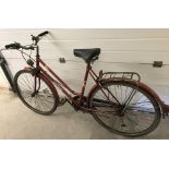 A ladies vintage 3 gear Mistral bicycle in red metallic paint finish.