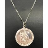 A boxed silver St Christopher medallion on a 18 inch fine belcher chain.