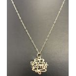 A 9ct gold Special Sister pendant on a 9ct gold very fine belcher chain.